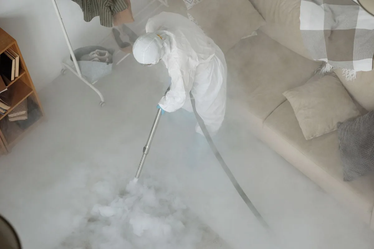 Biohazard cleanup technician in protective equipment, Weston, OH